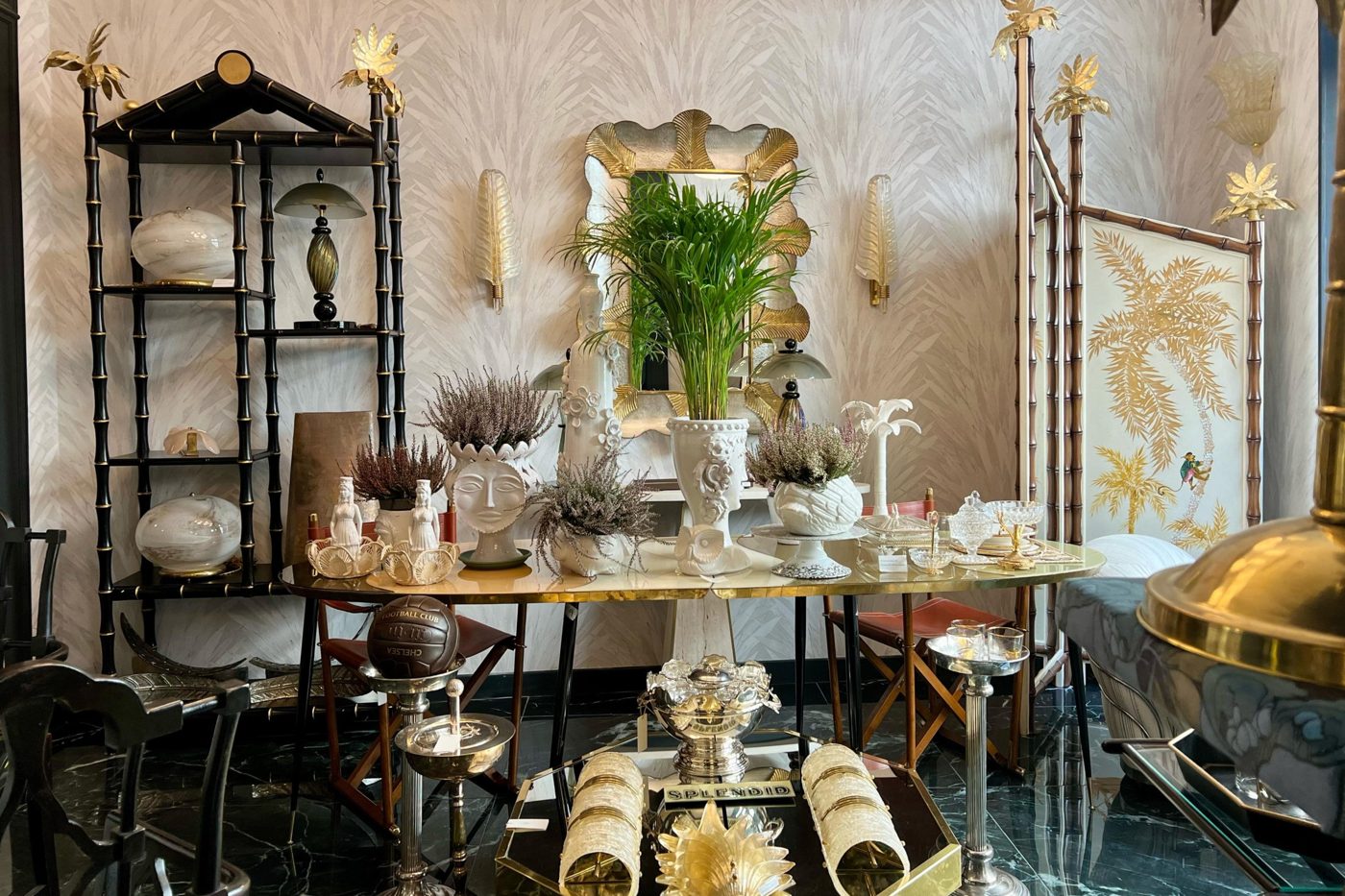 Showroom with gilded mirror and bamboo shelving